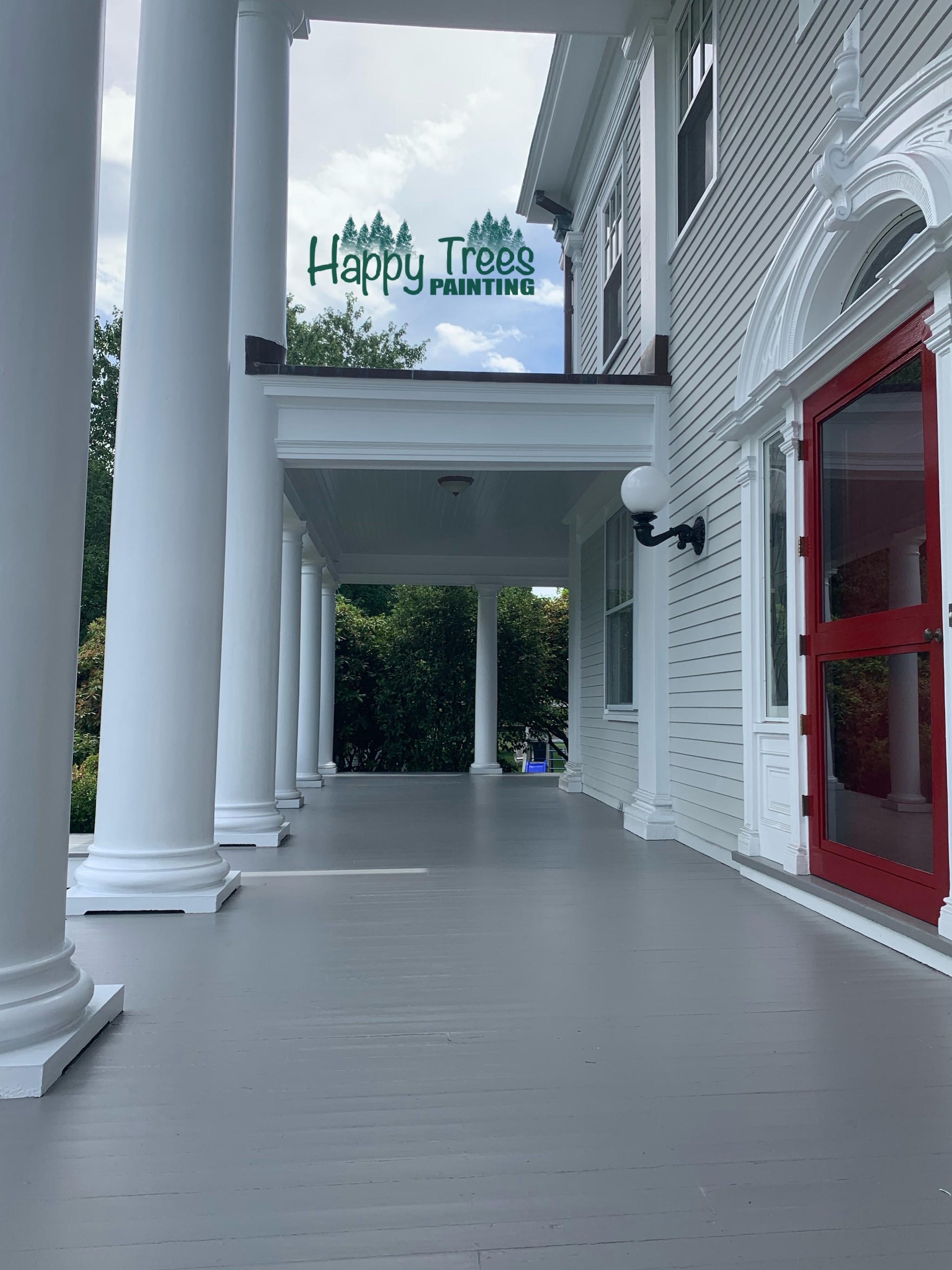 Classic colonial home exterior painting with white columns and red door in South County RI